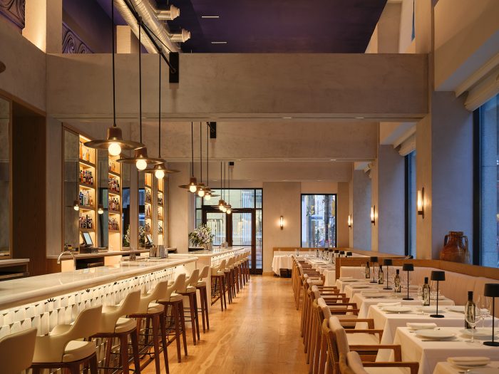 Lounge private event space at Milos Toronto showing private bar and banquette seating for 50